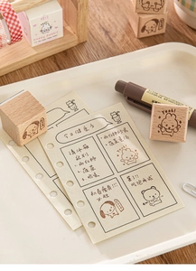 Close-up of cute wooden animal stamps and decorative stationery cards for journaling