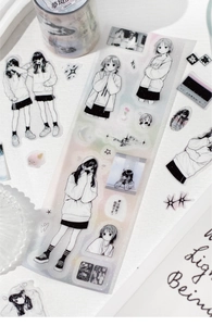 Macro shot of anime girl PET tape stickers for DIY journaling with vintage aesthetics