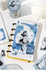 Detail of blue PET tape showing anime girls and ocean motifs for DIY journaling