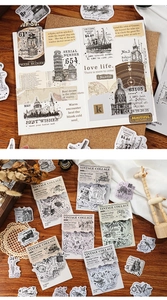 Macro shot of vintage architectural and botanical collage stickers for journal decorating