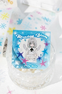 Detail of blue anime aesthetic sticky notes and washi tape styled in a crystal pearl cup