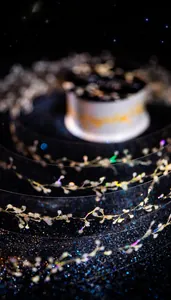 Macro detail of decorative PET tape with golden floral patterns and shell light finish