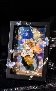Decorative black picture frame with butterfly theme and iridescent laser accents