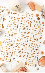 Macro shot of bread themed PET stickers with croissants and donuts for DIY journaling