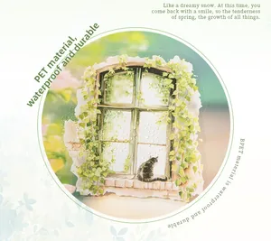 Detail of PET waterproof sticker with a cat on a window and ivy vines for DIY journals