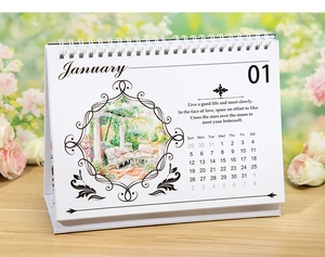 Detailed close-up of January page in a floral coil-bound desk calendar with rustic oil painting