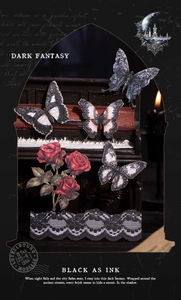 Gothic butterfly and rose stickers displayed on a mini piano in a dark fantasy setting
