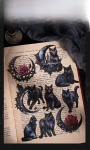 Gothic themed stickers featuring black cats, red roses, and moon motifs on vintage paper