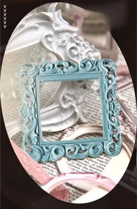 Detail view of cyan vintage embossed hollow frame for scrapbooking and DIY decor