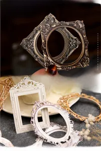 Detailed view of vintage laser-cut embossed resin frames with ornate antique textures