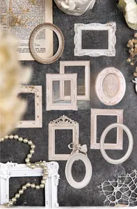 Detail showing vintage baroque relief frames with resin texture and antique finish