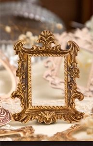 Macro shot of vintage baroque embossed frame with antique bronze texture for DIY collage