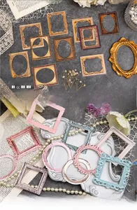 Macro detail of vintage embossed collage cards with decorative resin frames for DIY scrapbooking