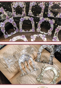 Detailed close-up of hollowed-out arched frames with purple floral gold stamping for scrapbooks