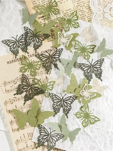 Vue détaillée de papillons en papier ajourés vintage pour décoration de scrapbooking