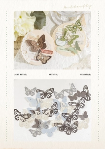 Gros plan de restes de papier papillon vintage avec découpes et perles de nacre