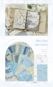 Λεπτομέρεια vintage σετ scrapbooking με μπλε δερμάτινο ντοσιέ και χαρτιά με φλοράλ υφές