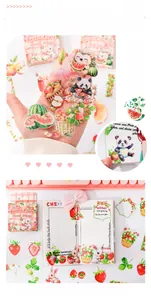 Close-up of floral and animal stickers being applied to a planner notebook