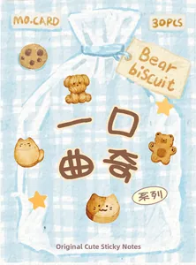Detail of cute animal cookie sticky notes with bear and cat designs for journaling