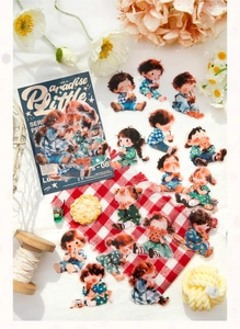 Detail of cute anime PET stickers featuring kids drinking tea on a cozy textured background