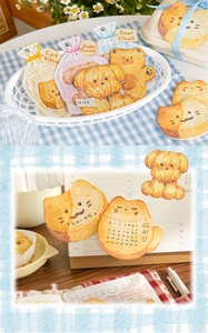 Detail of cute animal cookie-shaped sticky notes used in a daily planner decoration