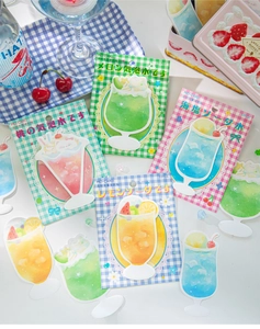 Flat lay of MO-CARD soda-themed decorative stickers and 30pcs memo pads for scrapbooking