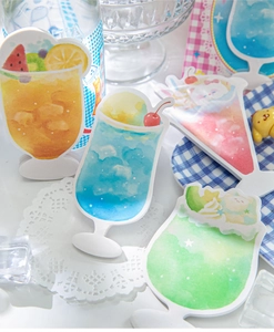 Detail of creative soda cup shaped sticky notes with hand-painted watercolor animal motifs