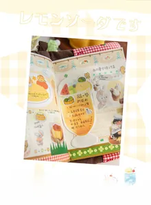 Close-up of cute animal themed sticky notes with red checkered cover and creative collage
