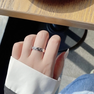 Minimalist 925 sterling silver ring with irregular lava texture shown on model hand