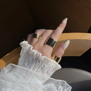 Minimalist wide band gold-plated S925 sterling silver rings shown on model hand