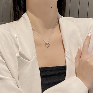 Vintage S925 sterling silver heart necklace with twisted texture on elegant model