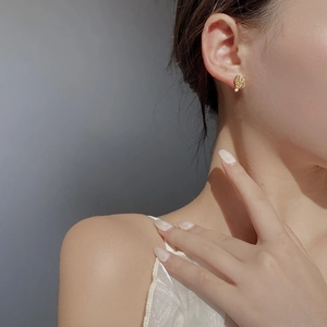 Minimalist 925 sterling silver heart stud earrings with irregular gold foil texture design