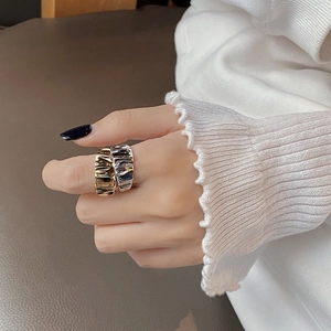 Set of two 925 sterling silver rings with irregular wave texture in gold and silver