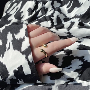 Polished 18k gold plated 925 sterling silver teardrop ring in an open adjustable style