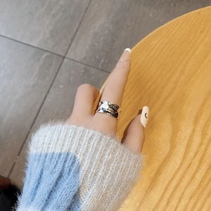 Minimalist S925 sterling silver wide ring with irregular hammered texture on model