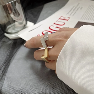 Minimalist S925 silver geometric ring with two offset squares shown on a model hand