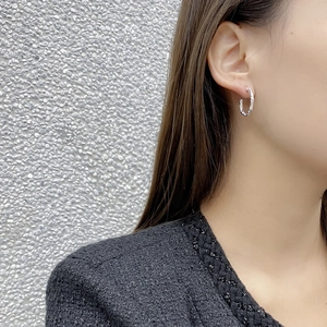 Minimalist 925 sterling silver irregular C-shape earrings with textured finish on model