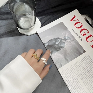 Minimalist geometric S925 silver rings in gold and silver matte finishes on model