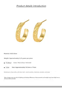 Macro detail of 18k gold S925 silver C-shape earrings with lava texture and specs