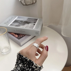 Minimalist 925 sterling silver ring with irregular textured lava finish in a stylish look