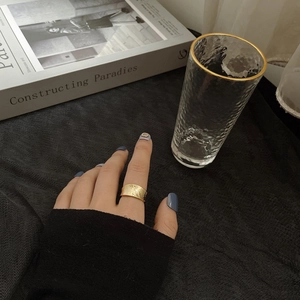 Detailed view of a wide gold hammered texture S925 sterling silver open band ring