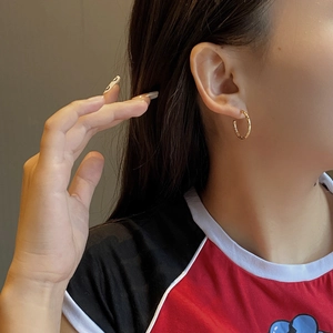 Chic S925 sterling silver golden hoop earrings with quilted lattice texture on model