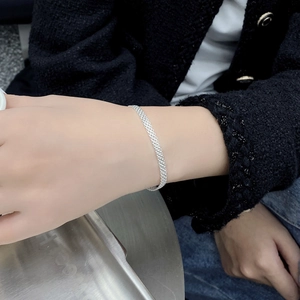 Sparkling S925 sterling silver four-row tank chain bracelet on a female model's wrist