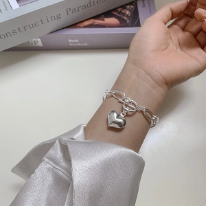925 Sterling Silver heart bracelet with OT buckle on wrist with minimalist Korean style