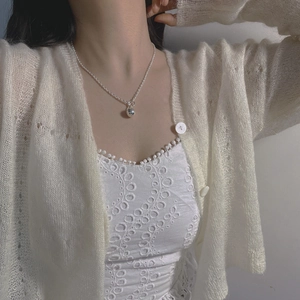 Elegant S925 sterling silver ball pendant necklace with OT buckle on a female model