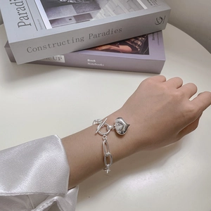 925 Sterling Silver Heart Bracelet with OT Toggle Clasp shown on a female wrist