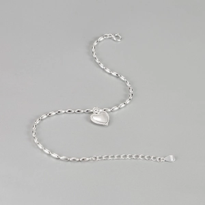 Elegant S925 sterling silver beaded heart bracelet with oval link chain on grey background