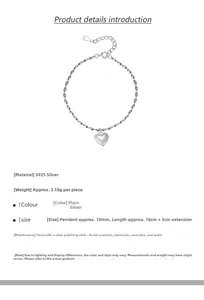 Macro detail of S925 sterling silver heart pendant and oval link chain with specs