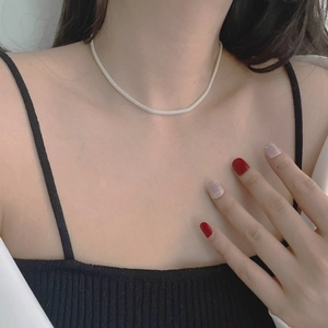 Close-up of 925 sterling silver mesh chain necklace showing woven metal texture