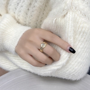 Golden textured S925 silver ring with zircon stone shown on a hand model